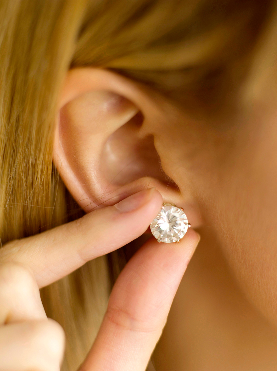 Putting on an earring